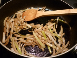 Using the same skillet, brown sliced onions. Add to mushrooms and set aside.